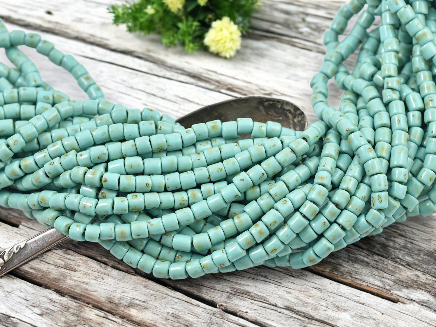 6/0 Aged Green Turquoise Picasso Tube Beads (20" Strand)